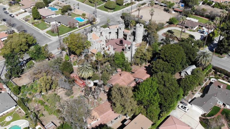 Ariel view of Rubel Castle Historic District, six story high castle and citrus ranch buildings in the foothills of Glendora.